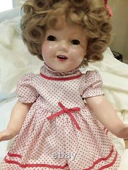 18 Shirley Temple Composition Doll with original shoes, socks, and slip