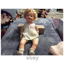18 inch Shirley Temple Baby doll with tagged dress