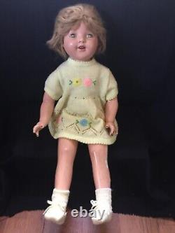 1930s VINTAGE SHIRLEY TEMPLE DOLL with KNIT DRESS, BOOTIES, CAP & SCARF DAMAGED