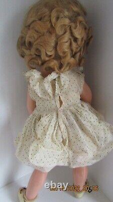 22 Inch Shirley Temple Composition Doll pin and tagged dress