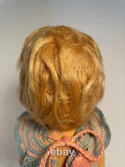Antique composition 11 Shirley Temple doll with original wig