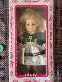 Shirley Temple Collection Dolls, Plates. Stamp Book, Pins, VHS, and Portrait