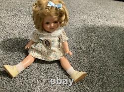 Shirley temple 13 inch doll with tagged dress and pin