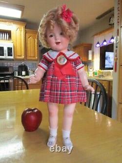 Vintage Shirley Temple compo doll, original tagged dress and pin, 18 AS-IS
