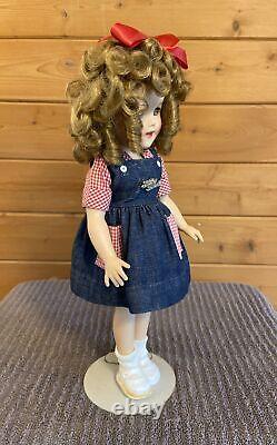Vintage Shirley Temple doll, 16 inches tall, some staining on her right shoe