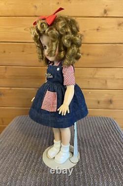 Vintage Shirley Temple doll, 16 inches tall, some staining on her right shoe